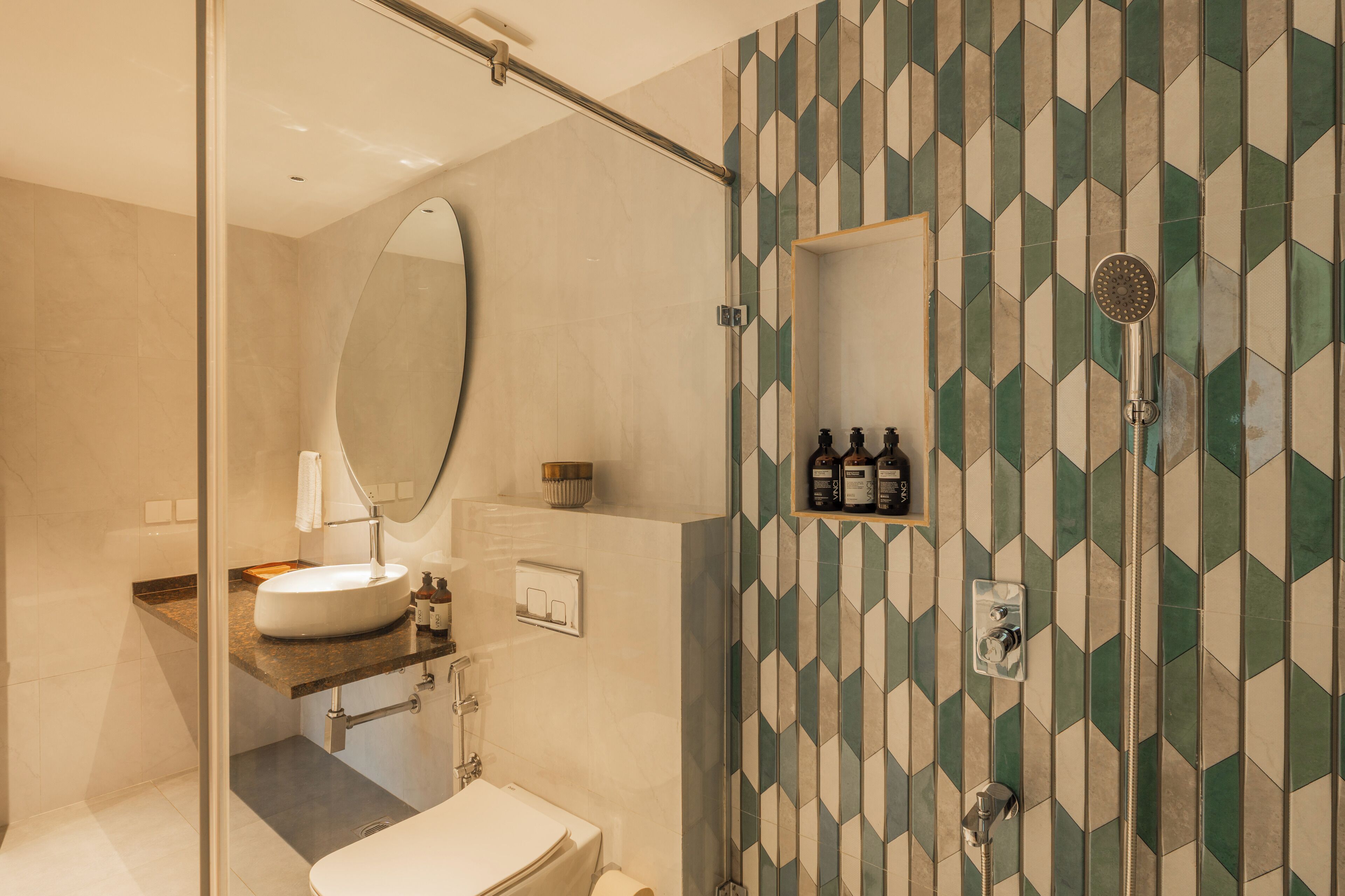 A modern bathroom with a freestanding bathtub, a large mirror, and a vanity with a sink and countertop.