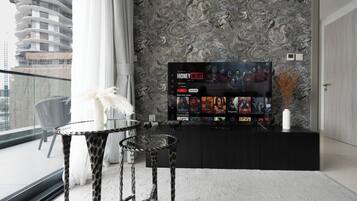 Deluxe Apartment, 1 Bedroom, Lake View | Living area | 125-cm flat-screen TV with digital channels