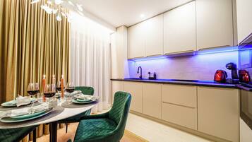 Apartment, City View | Private kitchen | Coffee/tea maker