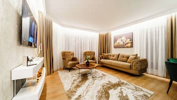 Apartment, City View | Living area | 160-cm Smart TV with digital channels