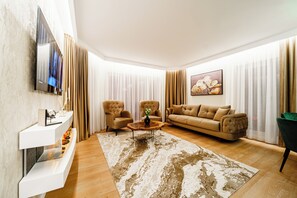 Apartment, City View | Living area | 160-cm Smart TV with digital channels