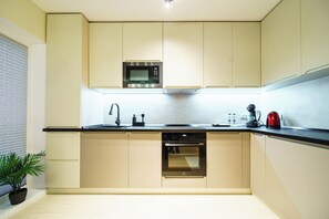 Apartment, Courtyard View | Private kitchen | Coffee/tea maker