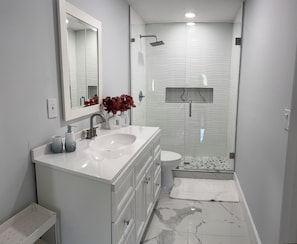 Shower, hair dryer, towels, soap