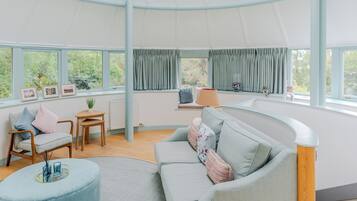 Apartment, Garden View | Living area | 24-inch Smart TV with cable channels