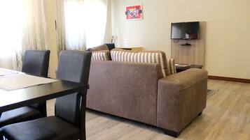 Deluxe Apartment | Living area | Printers