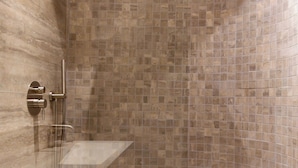 A modern bathroom with a curved shower, a sink, and a wooden cabinet. - Elegant Apartment With AC - 3br-6p- Montorgueil (Paris)
