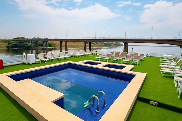 Outdoor pool, pool umbrellas, sun loungers