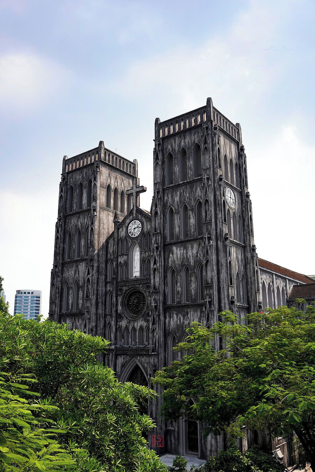 A large, historic cathedral with two prominent towers and a large clock on each tower.