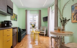 Hermes City Apartment | Living area | 50-inch Smart TV with satellite channels, Netflix, streaming services - Olympian Zeus Residences (Athens)