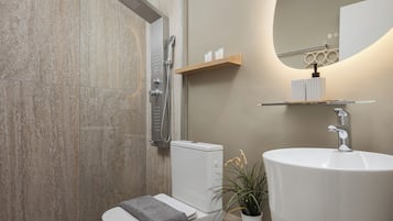 Artemis Apartment | Bathroom | Shower, rainfall showerhead, free toiletries, hair dryer