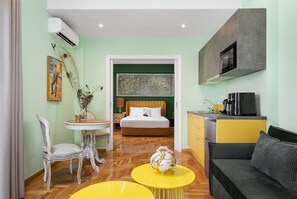 Hermes City Apartment | Living area | 50-inch Smart TV with satellite channels, Netflix, streaming services - Olympian Zeus Residences (Athens)