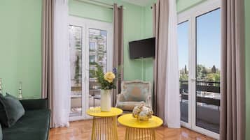 Hermes City Apartment | Living room | 50-inch Smart TV with satellite channels, Netflix, streaming services