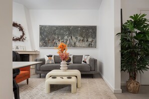 Hera Family Apartment | Living room | 50-inch Smart TV with satellite channels, Netflix, streaming services - Olympian Zeus Residences (Athens)