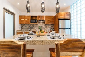 Fridge, microwave, stovetop, coffee/tea maker