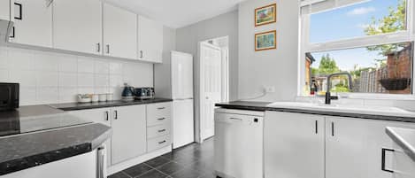 Microwave, cookware/dishes/utensils, dining tables