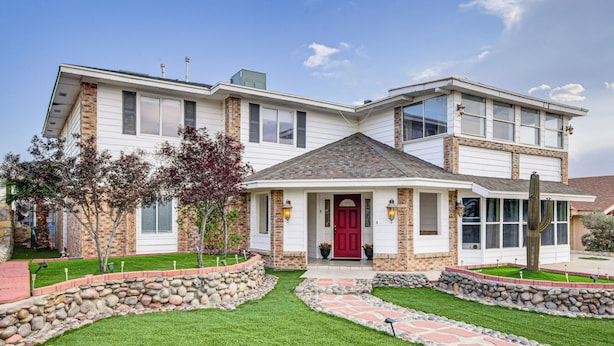 A two-story house with a red front door, stone steps, and a brick facade. - 13 Mi to Downtown El Paso: Home w/ Game Room & Bar (El Paso)