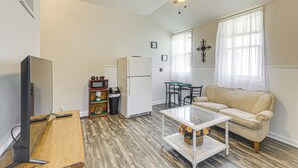 A compact living space with a kitchenette, a sofa, a glass coffee table, and a ceiling fan. - 2 Mi to Main Street! Cozy Winfield Launchpad (Winfield)
