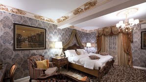 A classic bedroom with a large bed, ornate curtains, and a chandelier. - House of splendor Boutique Hotel (Lagos)