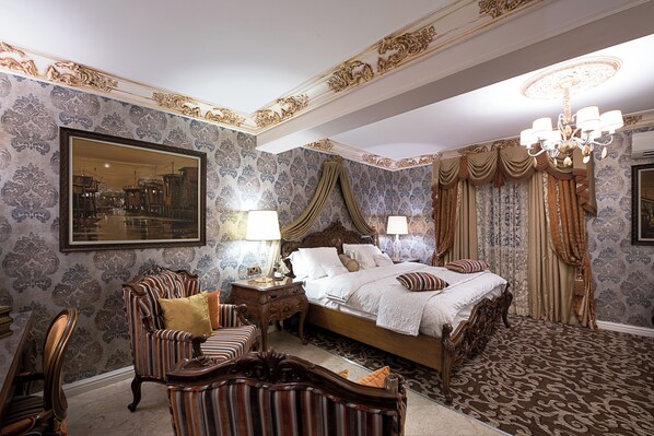 A classic bedroom with a large bed, ornate curtains, and a chandelier. - House of splendor Boutique Hotel (Lagos)