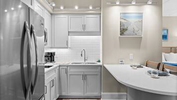Fridge, microwave, stovetop, coffee/tea maker