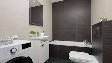 Shower, hair dryer, towels, shampoo