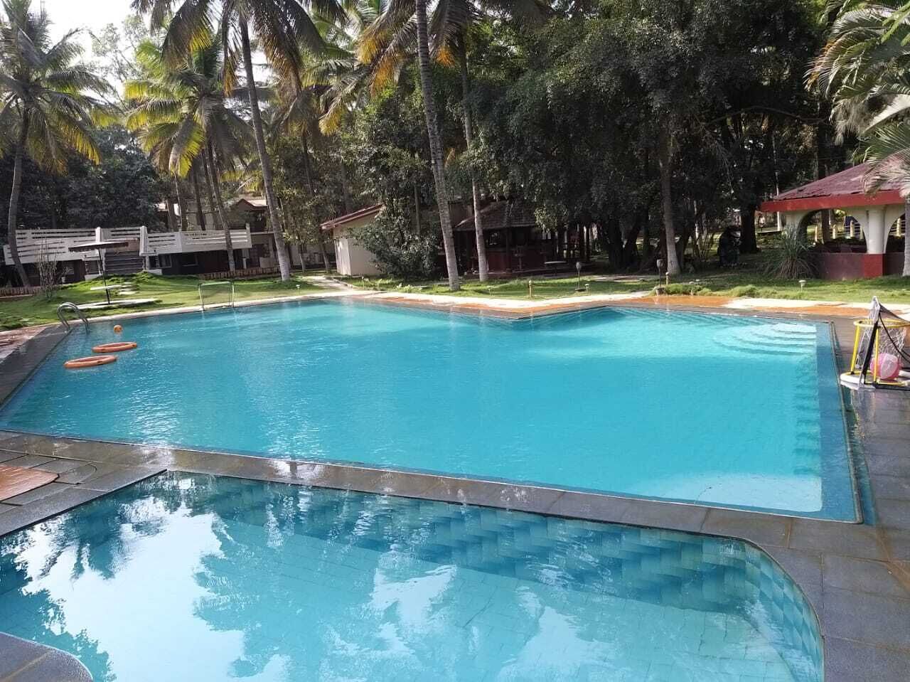 2 outdoor pools, open 9:30 AM to 6:00 PM, pool umbrellas, pool loungers