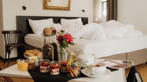 A neatly made breakfast tray with various food items and drinks on a table in a hotel room. - Adults Only Boutique-Hotel maison 41 (Bad Gleichenberg)