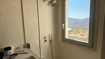 Romantic Suite, Sea View | Bathroom | Hair dryer, towels, soap, shampoo