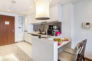 Fridge, microwave, stovetop, coffee/tea maker