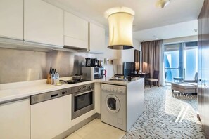 Fridge, microwave, stovetop, coffee/tea maker