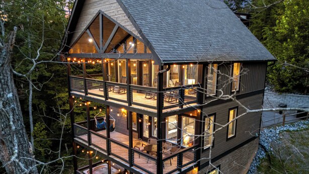 A multi-level cabin with outdoor seating areas and a hot tub. - Perfect Family Retreat MTN Views Pool Privacy (Sevierville)