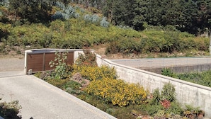 A paved pathway with a concrete barrier and a metal structure in the background. - Sweet 3 Bedrooms Terrace Home Close Esposende (Esposende)