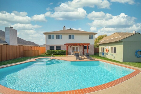 Outdoor pool, a heated pool - Heated Pool and SPA • Cozy Home • Game Room • Fire Pit • Near Lakes (Rowlett)
