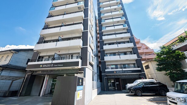 A multi-story building with balconies and a sign for "SpaZio II Canal Hakata." -  SPAZIO 2 Canal Hakata (Fukuoka)