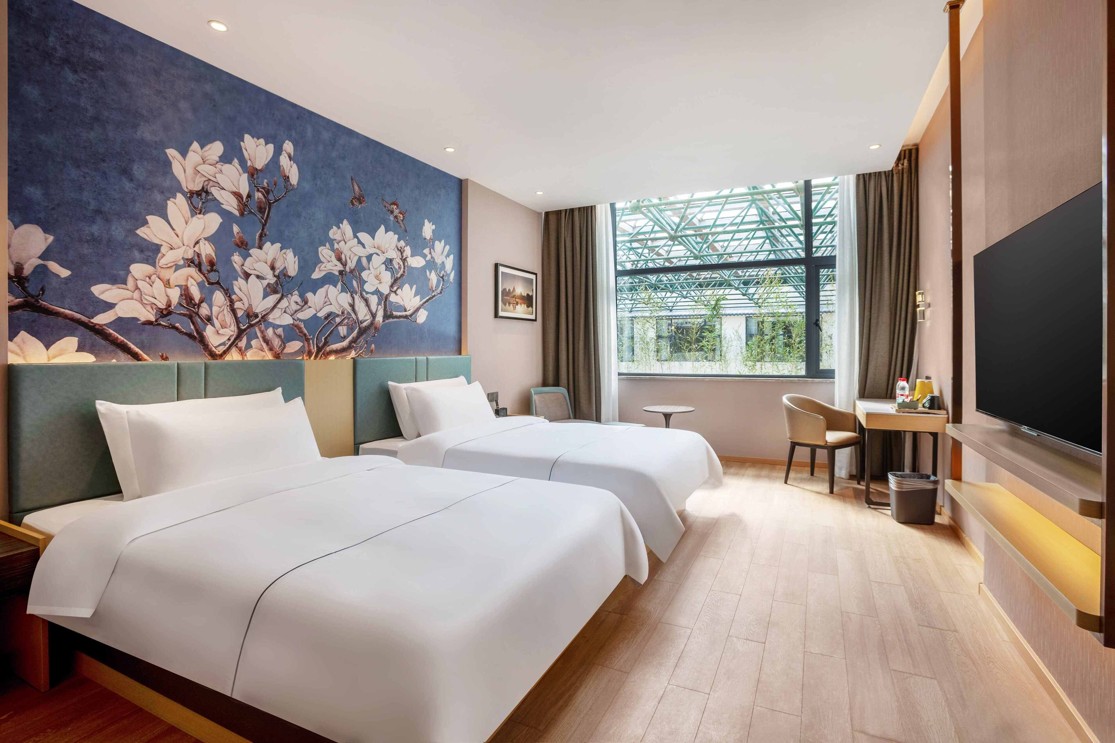 ห้องสแตนดาร์ดทวิน | เครื่องนอนระดับพรีเมียม, โต๊ะทำงาน, ผ้าม่านกันแสง, Wi-Fi ฟรี