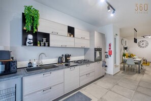 Fridge, microwave, oven, stovetop - Modern Żabbar home with Backyard + Garage Spot! (Żabbar)