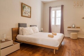 1 bedroom, desk, iron/ironing board, travel crib