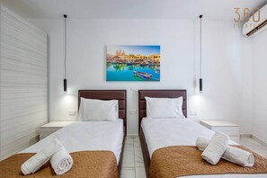 1 bedroom, desk, iron/ironing board, travel cot