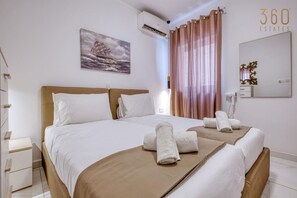 1 bedroom, desk, iron/ironing board, travel cot