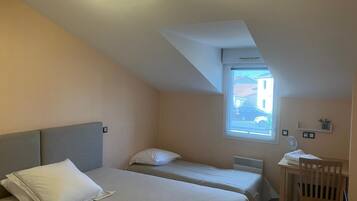 Family Triple Room, City View | Blackout drapes, iron/ironing board, free WiFi