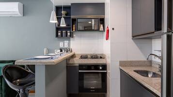 Microwave, oven, coffee/tea maker, cookware/dishes/utensils