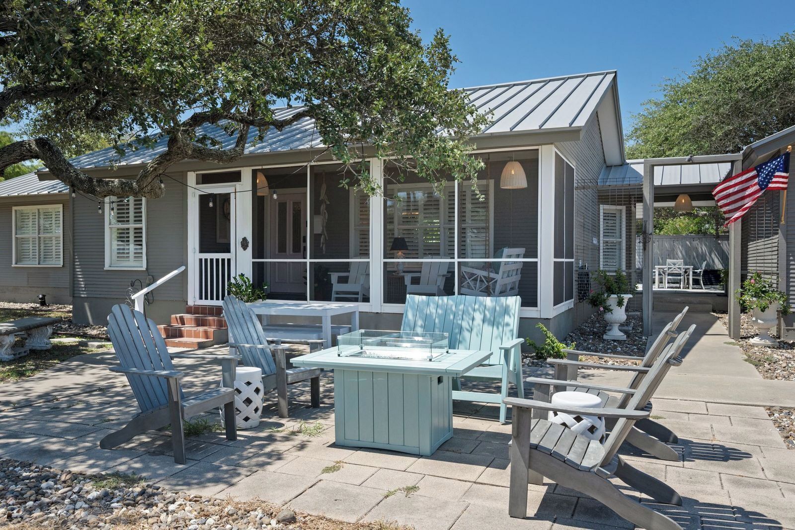 Propane firepit area with a dining table
in between the porch and firepit