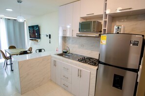 Fridge, microwave, coffee/tea maker, toaster