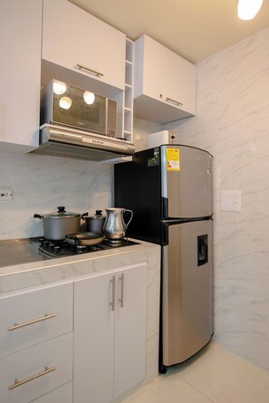 Fridge, microwave, coffee/tea maker, toaster