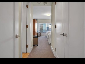 Luxury Suite, Partial Ocean View | Desk, laptop workspace, blackout curtains, free WiFi