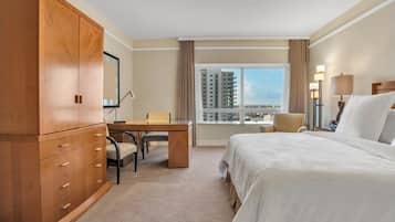 Luxury Suite, Partial Ocean View | Desk, laptop workspace, blackout curtains, free WiFi