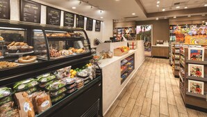 A bakery counter with pastries and a deli section with sandwiches and salads. - Marriott Shadow Ridge The Enclaves COACHELLA STAGECOACH (Palm Desert)