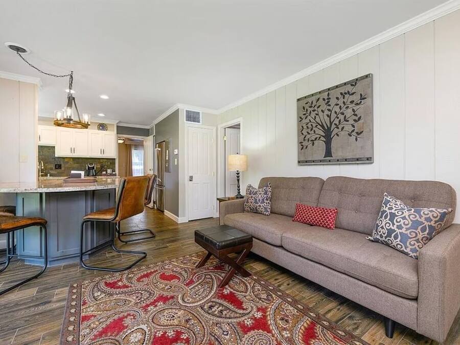 Deluxe Condo, Garden View | Living area | 55-inch flat-screen TV with digital channels