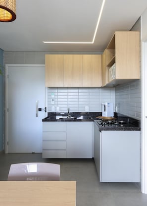 Family Apartment | Private kitchen | Full-size fridge, microwave, stovetop, cookware/dishes/utensils