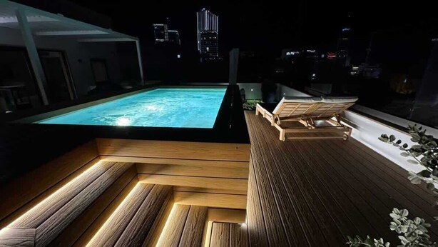 A rooftop pool area with wooden flooring and seating. - Sky villa penthouse, private pool | MIL by Homega (St. Julian's)